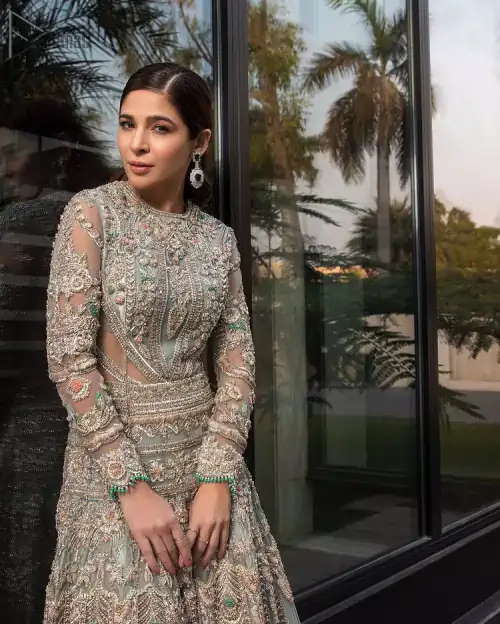 Pastel Green Large Flared Anarkali - Pakistani Wedding Gown. The bottom part of this amazing outfit comprises a lehenga with