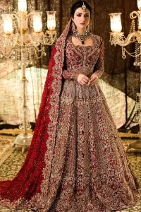 A truly exquisite ensemble that is sure to make heads turn on your big day. With a lot of attention to detail, the intricate sequencing using glass beading and threads makes the blouse look like nothing but a dream. Coordinated with a floor kissing asymmetrical lehenga adds to its charm. Intricate details, Refined craftsmanship is at its best with hand embellished zardozi work all over. Complete the look with a fully embellished dupatta adds the right amount of drama to this bridal outfit finished with scalloped borders and scattered sequins all over the ground.