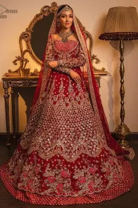 Make your moment memorable being a queen in red lehenga pishwas intensified with voguish sleeves and geometric patterns. This dreamy pishwas is adorned with an embellished bodice and finished with embroidered scallop border all around which gave a perfect ending to this flare. Lehenga is artistically adorned with tiny motifs all over the ground. Finish the look with a red accentuated lehenga having four-sided embellished borders and sequins spray all over the ground. Making it true that you can turn all the heads around with your gorgeous ability to wear the outfit in a way that is spectacular.