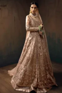 Pictured in a fabulous outfit, Chic and sophisticated perfectly describe this simply stunning wedding dress. The shirt is meticulously embellished with antique brass zardozi work. The sequinned whimsical florals embroidered across the flattering bodice in this ethereal gown is sure to turn heads in every room you walk into. Balance the look with a tea rose tissue lehenga. Pair it up with an organza dupatta which is sprayed with sequins glorifying its grace. Moreover, it is also enhanced with a four-sided embellished border that increases the enormous adornment of the whole outfit.