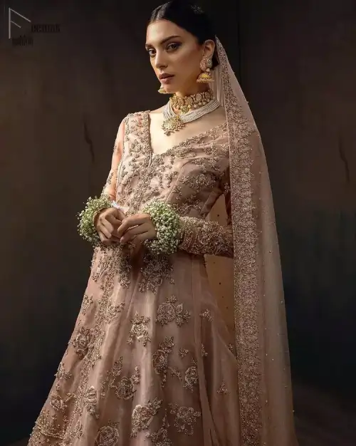 Pictured in a fabulous outfit, Chic and sophisticated perfectly describe this simply stunning wedding dress. The shirt is meticulously embellished
