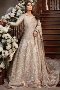 If you're seeking an imperial sensation, the Fawn Back Train Ruffled Maxi would definitely draw everyone's attention out of its soothing royal appearance. A full-sleeved maxi with a fascinating back train features a unique boat-shaped neckline to give this awesome bridal wear a western touch. To add the cherry on top, master artwork of silver embroidery is styled over its supreme matching embellishment and frilled bottom. A distinctive, yet highly gorgeous combination of a tissue maxi, a graceful silk churidar pyjama and a glamorous dupatta made out of pure organza completes this paragon of royalty. With its laudable design, this attire is surely going to make you the star of the night on your walima or nikkah day.