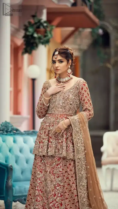 Red Peplum and Lehenga with Rust Net Dupatta. It features a highly remarkable back train and is decorated with fascinating
