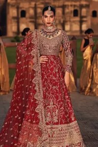 The maxi follows a graceful churidar pajama made with pure raw silk, with a red dupatta to complete your enchanting looks. This admirable dress is a treat to your reception day.