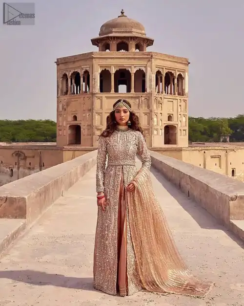 the dress with a tissue dupatta and graceful palazzo pants makes you the center of attention on your big day. Peach