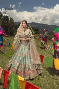 Talking about traditional, Deemas Fashion introduces the Aqua Lehenga and pink blouse which is an outstanding upgrade to bridal wear. This stunning full-sleeved attire presents an enchanting sweetheart neckline, embellished with the finest work of light golden embroidery, and adorned with pearls. This bridal wear has its own admiring look that comes with a tissue dupatta with embellished border. The Aqua colour of Lehenga gives so soothing look to the whole outfit. Furthermore, the lehenga is delicately adorned with golden kora, dabka, tilla, sequins and pearls embroidery. The border of the lehenga is also ornamented with embellished applique which gives the perfect ending to this outfit.