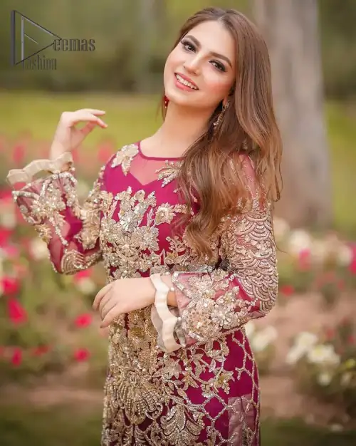 Take a step towards refreshing your wardrobe with a Shocking pink long Shirt. This dress is allured with floral embroidery.