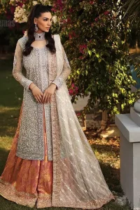 It's time to stock up your eventry wardrobe with the ensembles that have everyone hooked. Your mini fashionistas got stunned in this mint green and rust attire. Just look at the super detailing of a mint green front open shirt that is ornamented with silver embroidery that includes tilla, kora dabka, and crystal work. It is further enhanced with a Round neckline that gives so soothing display. It is coordinated with a Rust sharara, the border is sprinkled with silver embroidery and sequins spray all over that looks just priceless at any party. End up this attire with an ivory dupatta with a four-sided embellished border.