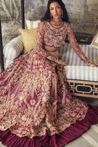 Create your own uniqueness. Let it be priceless for yourself and yet identifiable for others. Introducing burgundy blouse which is heavily adorned with golden embroidery that includes kora, doabka and magic of tilla. It is enhanced with the round shape neckline and full sleeves to make your remarkable moments lovely and a little romantic. Furthermore, it is systemized with a frilled lehenga that is again embellished with heavy embroidery. Finish this outfit with a scalloped dupatta in the same colour that is ornamented with a four-sided border to make you the priceless bride. 