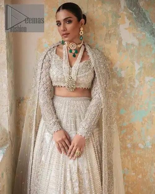 With a touch of Divine. A stunning ivory blouse is laboriously frosted with meticulously detailed hand embellishment with kora, dabka,