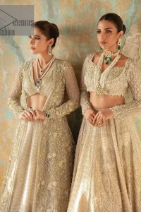 On a magical ivory afternoon, the sun reflects her radiance, the wind mimics her gaze. Starting this ivory article with an attractive and romantic blouse that is beautifully adorned with the same colour embroidery. The V shape neckline of the blouse adds a lovely feeling as well. In addition to this, it is organized with the same colour front open gown that is heavily adorned with tilla, dabka, kora and pearls embroidery. It is highlighted with full sleeves style that shows the uniqueness of the article. Paired up with the same colour lehenga to boost up the walima day of every bride. Complete this article with an ivory dupatta that is embellished with four-sided borders and sequins spray and tiny floral motifs spread all over. 