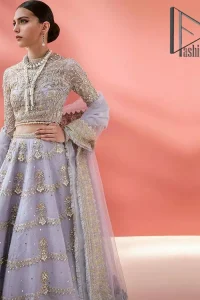 Love when our brides can completely be lost in the moment with their dresses. DeemasFashion presents a lilac article which is starting with a lilac blouse that is ornamented with golden embroidery. It is highlighted with tilla, dabka, pearls and the illusion of crystals. Furthermore, the full sleeves of the dress are attractively designed with a round shape neckline to boost your feelings on your walima day. It is handsomely coordinated with the same colour lehenga that is again embellished with golden embroidery. End up this outfit with the same colour dupatta that is embellished with four-sided borders and sequins sprayed all over to make a memorable event for the bride. 