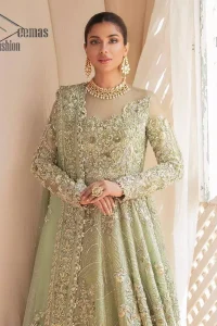 A time of life that is not just an occasion but a celebration. A pastel green scalloped maxi laboriously frosted with meticulously detailed hand embellished with silver tilla, dabka, and kora work blooming all over. Further, the jewel neckline and full sleeves of this article give so soothing feeling to you your walima day. It is handsomely coordinated with a pastel green lehenga that is again beautifully embellished. Complete this article with the organza dupatta in the same colour, heavily laden with a four-sided border and tiny floral motifs all over with a magical stream of pearls. 