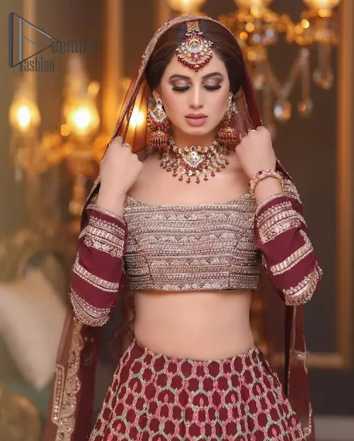 Attain your expectations on your big day with this dress. The classically vibrant combination of red and gold is a