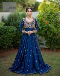 Hues of blues make a funky yet amazing pattern on amazing events. DeemasFashion introduces a navy blue outfit. Starting this article with a navy blue multiple panel frock which is ornamented with golden embroidery. The pattern of embroidery begins with the round neckline which is handsomely embellished with tilla, dabka, kora and Kundan. It is further prominent with full sleeves. The rest of the frock is decorated with floral motifs in a golden hue. The following frock comes with a golden dupatta to complete the admiring look on any day or night event.