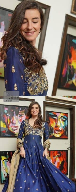 Hues of blues make a funky yet amazing pattern on amazing events. DeemasFashion introduces a navy blue outfit. Starting this article with a navy blue multiple panel frock which is ornamented with golden embroidery. The pattern of embroidery begins with the round neckline which is handsomely embellished with tilla, dabka, kora and Kundan. It is further prominent with full sleeves. The rest of the frock is decorated with floral motifs in a golden hue. The following frock comes with a golden dupatta to complete the admiring look on any day or night event.