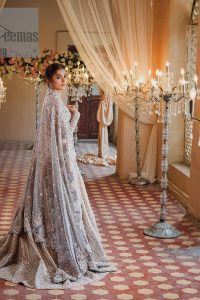 Amplify your style on your Walima day in this stunning light color. DeemasFashion presents the super handsome rose gold outfit for you. First of all, which includes back train maxi in the rose gold colour. It is prominent with the silver embroidery that is encrusted with pearls, silver crystals, kora, dabka and sequins all over highlighting floral patterns. Further, it is emphasized with boat shape neckline and full sleeves that increase the opulent statement of the outfit. It is organized with rose gold sharara which is also embellished with heavy silver embroidery to make your day super dazzling. Finish this look with the rose gold dupatta that is accentuated with sequins and booti spray all over and adorned with a four-sided matha Patti border. 