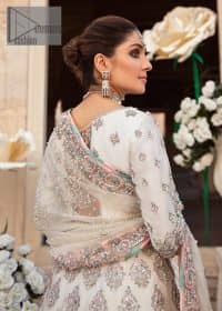 Ivory is effortlessly snappy and fun with the essence of pop. Introducing the Walima outfit for the happiest bride. Starting the outfit with an astonishing blouse having golden embroidery which includes kora, dabka, tilla and Kundan to make this outfit a unique piece of fun. Further, it is enhanced with boat shape neckline with intimate full sleeves. It is beautifully organized with a can-can lehenga in the same colour to embrace the magic of love. The floral embroidery on the lehenga gives a super aesthetic feeling to the outfit. Finish this look with the handsome dupatta in the same hue having a four-sided embellished border and sequins sprayed all over to show the essence of pop.