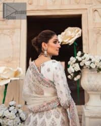 Ivory is effortlessly snappy and fun with the essence of pop. Introducing the Walima outfit for the happiest bride. Starting the outfit with an astonishing blouse having golden embroidery which includes kora, dabka, tilla and Kundan to make this outfit a unique piece of fun. Further, it is enhanced with boat shape neckline with intimate full sleeves. It is beautifully organized with a can-can lehenga in the same colour to embrace the magic of love. The floral embroidery on the lehenga gives a super aesthetic feeling to the outfit. Finish this look with the handsome dupatta in the same hue having a four-sided embellished border and sequins sprayed all over to show the essence of pop.