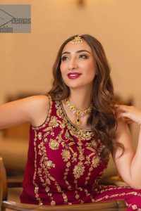 The golden pasting on a glamorous magenta canvas. The beautiful attire is presented that begins with a magenta long shirt which is attractively furnished with golden embroidery. It is spotlighted with tilla, dabka, kora and zardozi to make your event blazing and astonishing. In addition to this, it is attractively featured with a round neckline and sleeveless style. The following magenta long shirt is paired up with purple trousers that's border is again embellished with golden embroidery that gives a unique piece of style in every function.