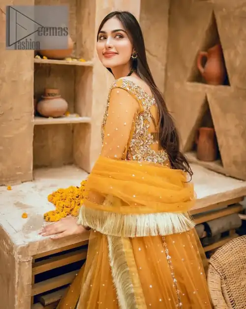 Mustard is just associated and boosts your Mehandi.  Presenting a dreamy mustard frock with a heavily embroidered bodice on a