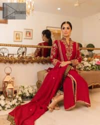 The forever favourite red dress channelling your inner diva. A luxury red long shirt rendered with intimate embroidery in golden colour to make your event blazing and remembering one. It is highlighted with tilla, dabka, kora and pearls that are a perfect blooming outfit in our collection. The collar neckline and full sleeves add attractiveness to the outfit. It comes with black pant to give you a more formal look at any precious event. The border of the pants is adorned with golden embroidery as well. End up this look with red dupatta which is embellished with a four-sided border and sequins spray all over for your constant love for red.