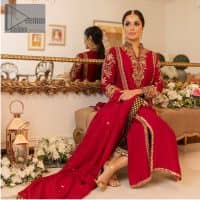 The forever favourite red dress channelling your inner diva. A luxury red long shirt rendered with intimate embroidery in golden colour to make your event blazing and remembering one. It is highlighted with tilla, dabka, kora and pearls that are a perfect blooming outfit in our collection. The collar neckline and full sleeves add attractiveness to the outfit. It comes with black pant to give you a more formal look at any precious event. The border of the pants is adorned with golden embroidery as well. End up this look with red dupatta which is embellished with a four-sided border and sequins spray all over for your constant love for red.