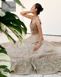 The perfect outfit for walima to enhance your glow. Starting this article with a dream rust blouse having a strap neckline and prominent sleeveless style to embrace the romantic culture. The following blouse is fully embellished with golden embroidery that is prominent with tilla, dabka, kora, pearls and sequins spray to fulfil your dreamy look. It is coordinated with an ivory can-can lehenga whose border is again rendered with golden embroidery and sequins sprayed all over to continue the look. Complete this outfit with a rust dupatta which is embellished with four-sided borders and sequins sprayed all over to enhance the glow of the bride.