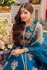 Blue defines your beauty and glows your face at any event. Starting this article with teal blue front open pishwas that are decorated with handsome golden embroidery placed like floral motifs. It is prominent with tilla, dabka, kora and Kundan to enhance the gold in blue. In addition to this, it is styled with a sleeveless and round neckline to make your day better and the best. The following pishwas are coordinated with a can-can lehenga whose border is again adorned with heavy embellishment Complete this party look with a teal blue dupatta that is rendered with four-sided borders and floral motifs all over to put a glow on your face.