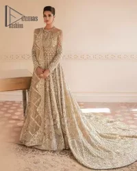 Something to Beige about! This nikah wear article is specially presented by DeemasFashion featuring thoughtfully designed ensembles with a rich beige colour maxi and dupatta that are flattering on the body's quintessential details. The Jewel neckline of the nikah wear maxi is attractively combined with the back train that is heavily adorned with light golden dabka, tilla, zardozi embroidery for the finest look. In addition to this, it is paired up with the same colour dupatta that is again ornamented with a four-sided border and sequins spray all over to fulfil your finest promising look on your nikah day.