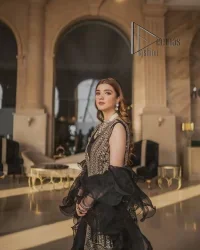 Wear black in-depth to lead colourful lives. DeemasFashion presents black party wear which includes a front open maxi having light golden embroidery which is beautifully decorated with tilla, dabka, kora and Kundan. Further, it is prominent with sleeveless style and sweetheart neckline to make you a memorable girl of the event. The part wear is organized with a frilled lehenga which is a unique core piece. Complete this party wear with a dupatta in the same colour to boost your day with black.