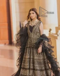 Wear black in-depth to lead colourful lives. DeemasFashion presents black party wear which includes a front open maxi having light golden embroidery which is beautifully decorated with tilla, dabka, kora and Kundan. Further, it is prominent with sleeveless style and sweetheart neckline to make you a memorable girl of the event. The part wear is organized with a frilled lehenga which is a unique core piece. Complete this party wear with a dupatta in the same colour to boost your day with black.