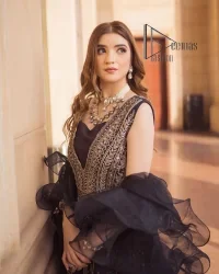 Wear black in-depth to lead colourful lives. DeemasFashion presents black party wear which includes a front open maxi having light golden embroidery which is beautifully decorated with tilla, dabka, kora and Kundan. Further, it is prominent with sleeveless style and sweetheart neckline to make you a memorable girl of the event. The part wear is organized with a frilled lehenga which is a unique core piece. Complete this party wear with a dupatta in the same colour to boost your day with black.