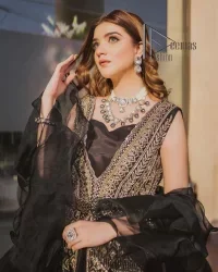Wear black in-depth to lead colourful lives. DeemasFashion presents black party wear which includes a front open maxi having light golden embroidery which is beautifully decorated with tilla, dabka, kora and Kundan. Further, it is prominent with sleeveless style and sweetheart neckline to make you a memorable girl of the event. The part wear is organized with a frilled lehenga which is a unique core piece. Complete this party wear with a dupatta in the same colour to boost your day with black.
