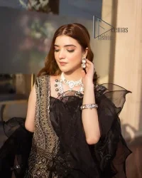 Wear black in-depth to lead colourful lives. DeemasFashion presents black party wear which includes a front open maxi having light golden embroidery which is beautifully decorated with tilla, dabka, kora and Kundan. Further, it is prominent with sleeveless style and sweetheart neckline to make you a memorable girl of the event. The part wear is organized with a frilled lehenga which is a unique core piece. Complete this party wear with a dupatta in the same colour to boost your day with black.