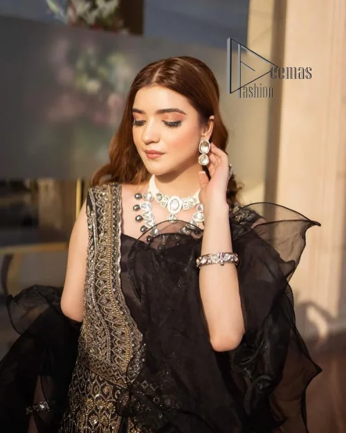 Wear black in-depth to lead colourful lives. DeemasFashion presents black party wear which includes a front open maxi having light