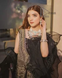 Wear black in-depth to lead colourful lives. DeemasFashion presents black party wear which includes a front open maxi having light golden embroidery which is beautifully decorated with tilla, dabka, kora and Kundan. Further, it is prominent with sleeveless style and sweetheart neckline to make you a memorable girl of the event. The part wear is organized with a frilled lehenga which is a unique core piece. Complete this party wear with a dupatta in the same colour to boost your day with black.