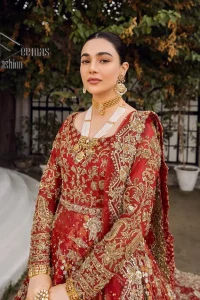 Feels just redish on your Big day to make your day lovely and romantic. DeemasFashion presents this Pakistani reception wear for you in bright red colour which begins with a flared back train maxi. The maxi is attractively and laboriously adorned with golden embroidery that enhances tilla,dabka, kora and Kundan. In addition to this, the boat shape neckline intensifies the beauty of this Pakistani reception wear when comes with full sleeves. The flared back train of the maxi is also heavily embellished. Complete this article with a dupatta in the same colour which is adorned with four-sided borders and tiny floral motifs, sequins spray all over to make you fresh on your Big day.