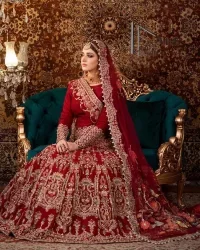 There is a shade of deep red for every bride. This Pakistani reception article begins with a deep red blouse which is simple but handsome and attractive. The blouse has boat shape neckline and full sleeves. The border of the sleeves is beautifully embellished with light golden embroidery. Furthermore, the Pakistani reception article also includes a fit and flare lehenga having heavy embroidery in light golden colour to make your day more romantic. Complete this Pakistani reception article with a deep red dupatta which is adorned with a four-sided border to give you a flavour shade of a Pakistani bride.