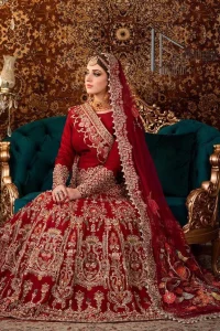 There is a shade of deep red for every bride. This Pakistani reception article begins with a deep red blouse which is simple but handsome and attractive. The blouse has boat shape neckline and full sleeves. The border of the sleeves is beautifully embellished with light golden embroidery. Furthermore, the Pakistani reception article also includes a fit and flare lehenga having heavy embroidery in light golden colour to make your day more romantic. Complete this Pakistani reception article with a deep red dupatta which is adorned with a four-sided border to give you a flavour shade of a Pakistani bride.