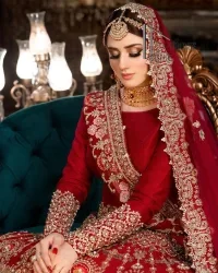 There is a shade of deep red for every bride. This Pakistani reception article begins with a deep red blouse which is simple but handsome and attractive. The blouse has boat shape neckline and full sleeves. The border of the sleeves is beautifully embellished with light golden embroidery. Furthermore, the Pakistani reception article also includes a fit and flare lehenga having heavy embroidery in light golden colour to make your day more romantic. Complete this Pakistani reception article with a deep red dupatta which is adorned with a four-sided border to give you a flavour shade of a Pakistani bride.