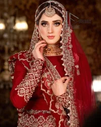 There is a shade of deep red for every bride. This Pakistani reception article begins with a deep red blouse which is simple but handsome and attractive. The blouse has boat shape neckline and full sleeves. The border of the sleeves is beautifully embellished with light golden embroidery. Furthermore, the Pakistani reception article also includes a fit and flare lehenga having heavy embroidery in light golden colour to make your day more romantic. Complete this Pakistani reception article with a deep red dupatta which is adorned with a four-sided border to give you a flavour shade of a Pakistani bride.
