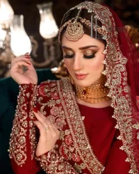 There is a shade of deep red for every bride. This Pakistani reception article begins with a deep red blouse which is simple but handsome and attractive. The blouse has boat shape neckline and full sleeves. The border of the sleeves is beautifully embellished with light golden embroidery. Furthermore, the Pakistani reception article also includes a fit and flare lehenga having heavy embroidery in light golden colour to make your day more romantic. Complete this Pakistani reception article with a deep red dupatta which is adorned with a four-sided border to give you a flavour shade of a Pakistani bride.