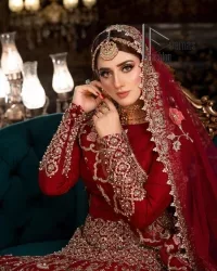 There is a shade of deep red for every bride. This Pakistani reception article begins with a deep red blouse which is simple but handsome and attractive. The blouse has boat shape neckline and full sleeves. The border of the sleeves is beautifully embellished with light golden embroidery. Furthermore, the Pakistani reception article also includes a fit and flare lehenga having heavy embroidery in light golden colour to make your day more romantic. Complete this Pakistani reception article with a deep red dupatta which is adorned with a four-sided border to give you a flavour shade of a Pakistani bride.