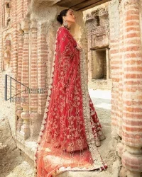 Begin your new life by wearing a romantic deep red outfit. Introducing this Pakistani reception wear that begins with a handsome blouse which is adorned with tiny floral motifs all over in light golden colour. The boat shape neckline steals the spotlight of the event when comes with three-quarter sleeves. It is combined with flared lehenga which is heavily adorned with a light golden embroidery to make your event lovely and charming. Complete this Pakistani reception wear with a dupatta in the same colour which border is heavily embellished that is ideal for modern festives.