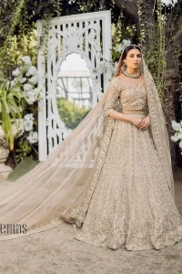 If you are getting married, you need a quality outfit. So, DeemasFashion presents this nikah outfit for you in fawn colour which begins with a fawn blouse that is laboriously and meticulously hand–rendered with silver and matching embroidery. It enhances with tilla, dabka, kora and Kundan that is portraying the dreamy vibe. The V Shape neckline of the blouse is a stylish way to steal the spotlight. The Nikah outfit is paired up with a can-can lehenga which is again heavily embellished with lushly detailed embroidery. Complete this nikah outfit with a dupatta in the same colour which is beautifully ornamented with a four-sided border which is ideal for modern festives.