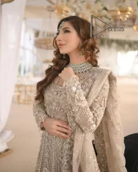 Start your new life by wearing DeemasFashion. Make your moment more memorable with light fawn heavy maxi nikah wear which is laboriously hand-rendered with silver and the same colour embroidery that enhances tilla, dabka, kora and crystal. The boat shape neckline and full sleeves of this maxi also add memorable beauty to your Qabool Hai moment. The maxi of this nikah wear is systemized with a dupatta in the same colour which is ornamented with four-sided borders and sequins sprayed all over to enhance the attractiveness of the nikah wear.