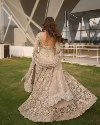 Start your new life by wearing DeemasFashion. Make your moment more memorable with light fawn heavy maxi nikah wear which is laboriously hand-rendered with silver and the same colour embroidery that enhances tilla, dabka, kora and crystal. The boat shape neckline and full sleeves of this maxi also add memorable beauty to your Qabool Hai moment. The maxi of this nikah wear is systemized with a dupatta in the same colour which is ornamented with four-sided borders and sequins sprayed all over to enhance the attractiveness of the nikah wear.