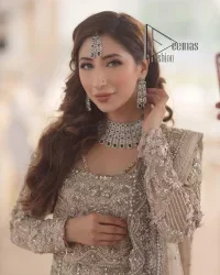 Start your new life by wearing DeemasFashion. Make your moment more memorable with light fawn heavy maxi nikah wear which is laboriously hand-rendered with silver and the same colour embroidery that enhances tilla, dabka, kora and crystal. The boat shape neckline and full sleeves of this maxi also add memorable beauty to your Qabool Hai moment. The maxi of this nikah wear is systemized with a dupatta in the same colour which is ornamented with four-sided borders and sequins sprayed all over to enhance the attractiveness of the nikah wear.