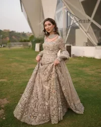 Start your new life by wearing DeemasFashion. Make your moment more memorable with light fawn heavy maxi nikah wear which is laboriously hand-rendered with silver and the same colour embroidery that enhances tilla, dabka, kora and crystal. The boat shape neckline and full sleeves of this maxi also add memorable beauty to your Qabool Hai moment. The maxi of this nikah wear is systemized with a dupatta in the same colour which is ornamented with four-sided borders and sequins sprayed all over to enhance the attractiveness of the nikah wear.
